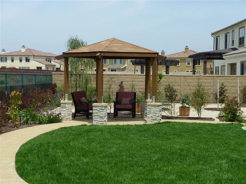 Backyard gazebo with artificial turf lawn
